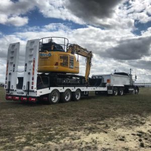 Ultimate Plant Trailers Tri Axle Pulled By A Kenworth With A New Komatsu Excavtor